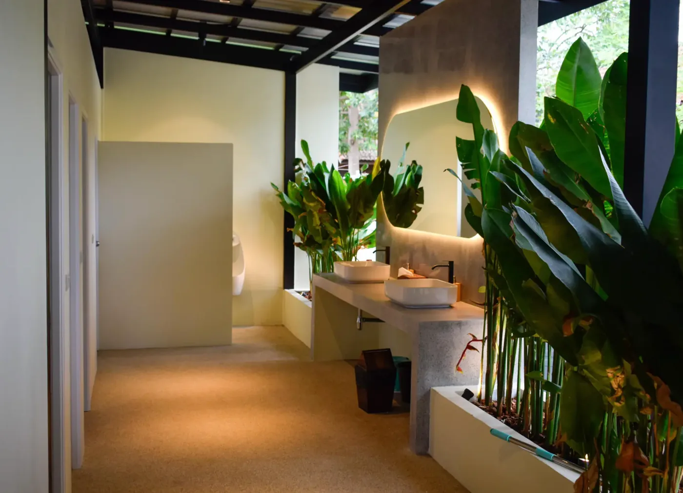 Modern tropical washroom facilities with plants at Padel Tropical Koh Samui