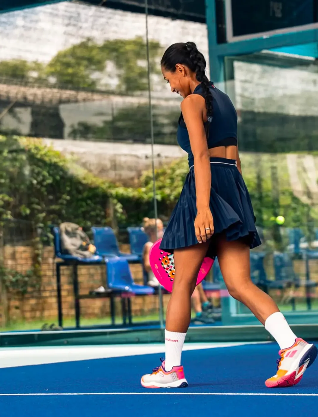 Player with a pink padel racket on court at Padel Tropical Koh Samui